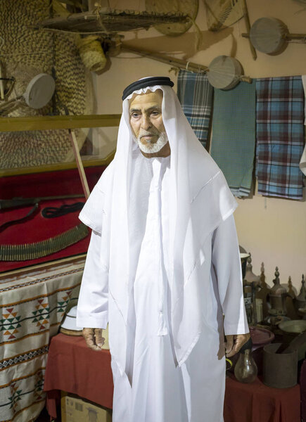 emirati man with UAE heritage items