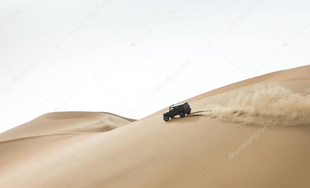 car driving in Rub al Khali Desert 