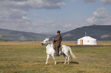 mongolian man riding a horse clipart