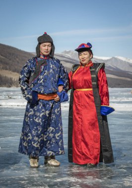 mongolian people dressed in traditional clothing  clipart