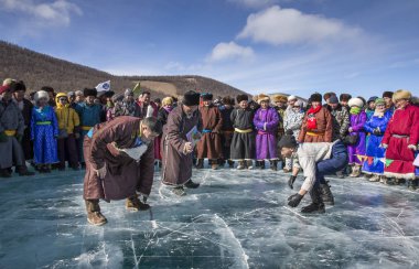 men wrestling on frozen lake clipart