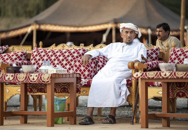 Al Ain, United Arab Emirates, 16th November 2019: emirati man in traditional clothing resting
