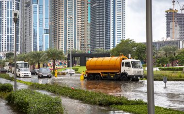 Dubai, United Arab Emirates, 11 January 2020: cars driving in flooded street of Dubai after a heavy rainfall