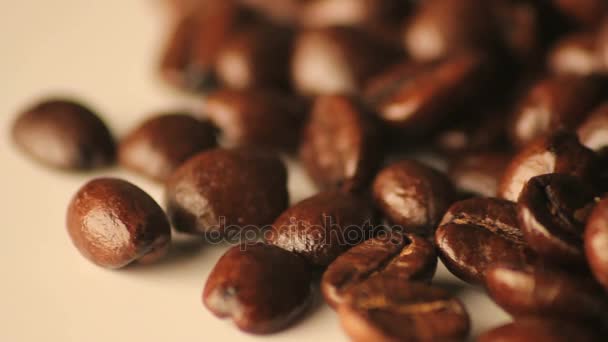 Rotating spilled coffee beans — Stock Video