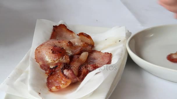 Thick cut bacon transferred to white plate — Stock Video