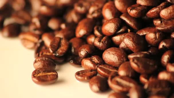 Bright rotating coffee beans — Stock Video