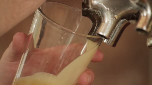 Close up on fast beer pour from tap lots of foam — Stock Video