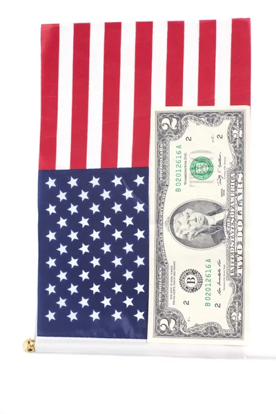 Dois dólares na bandeira americana — Fotografia de Stock