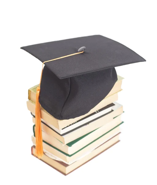 Graduation Hat with books isolated on white — Stock Photo, Image