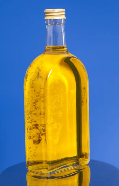 Oil in glass bottle — Stock Photo, Image