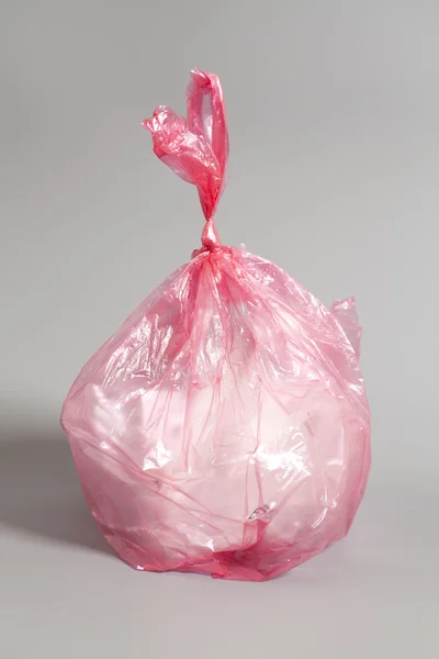 Garbage bag on a gray background — Φωτογραφία Αρχείου