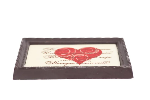Chocolade frame met rood hart geïsoleerd op witte achtergrond — Stockfoto