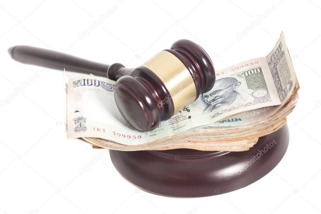 Judge gavel and Indian Currency Rupee bank notes on white backgr