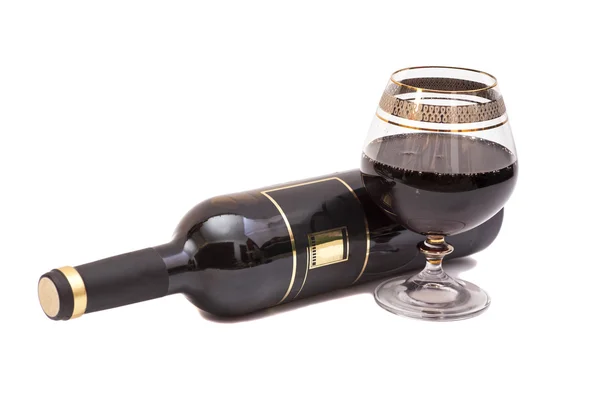 Rött vin flaska och glas med vin — Stockfoto