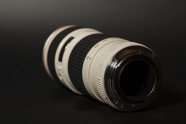 Camera photo lens over black background — Stock Photo, Image