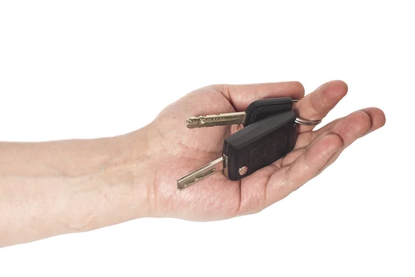 Χέρι με τα κλειδιά του αυτοκινήτου σε απομονωμένα σε λευκό φόντο — Φωτογραφία Αρχείου