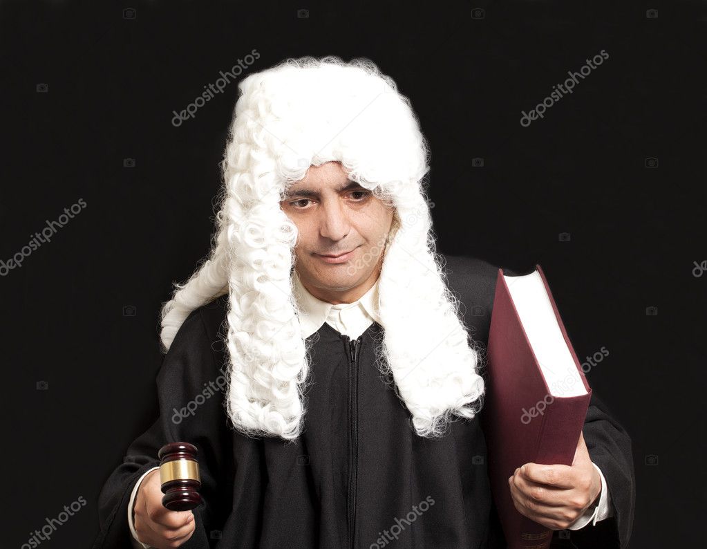 Portrait Of Male Lawyer Holding Judge Gavel And Book on black ba