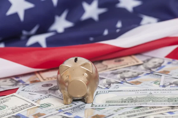 Golden Piggy Bank on Dollars with American Food — стоковое фото