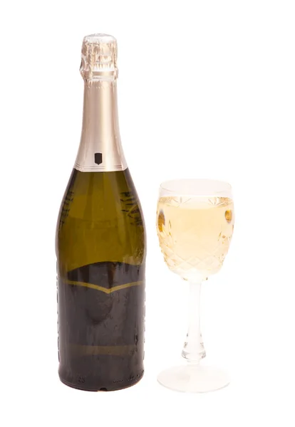 Champagneflaska och champagne glas — Stockfoto