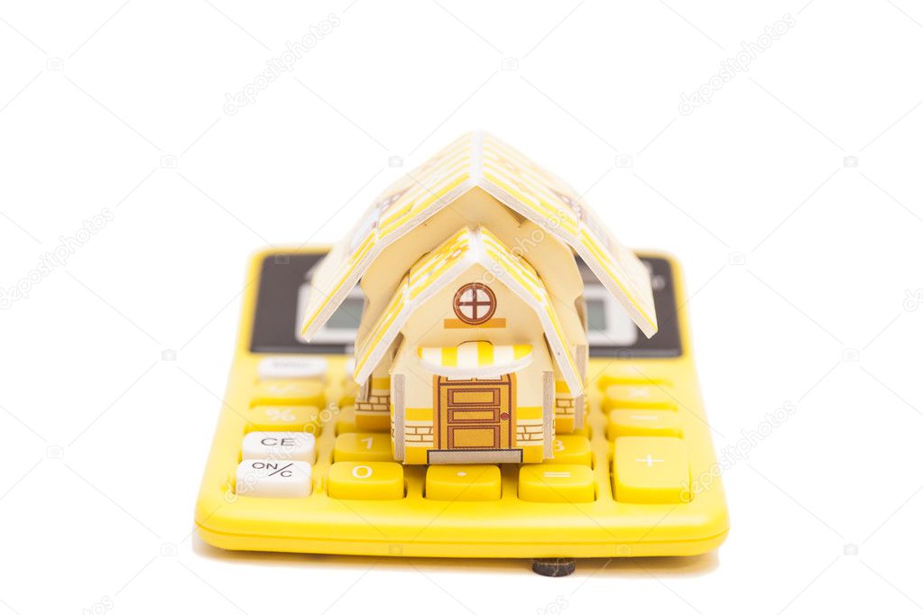 house and calculator isolated on white background 