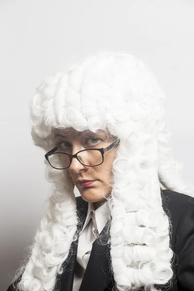 Female judge wearing a wig with eyeglasses  on white — Stock Photo, Image