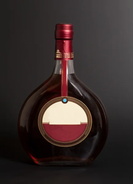 Cognac bottle on black background