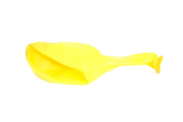 Balão amarelo de borracha deflacionada — Fotografia de Stock
