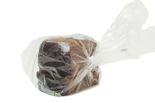 在白色背景上分离的塑料袋面包 — 图库照片