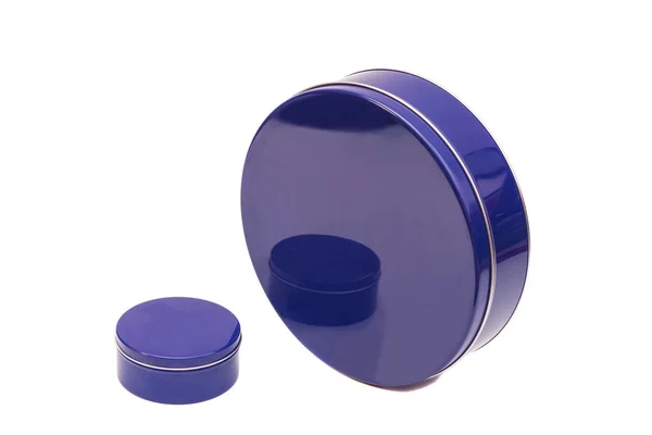 Kék kerek fém dobozok egy fehér háttér — Stock Fotó
