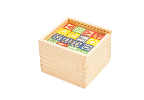 Cubes jouet en bois avec lettres sur la boîte — Photo
