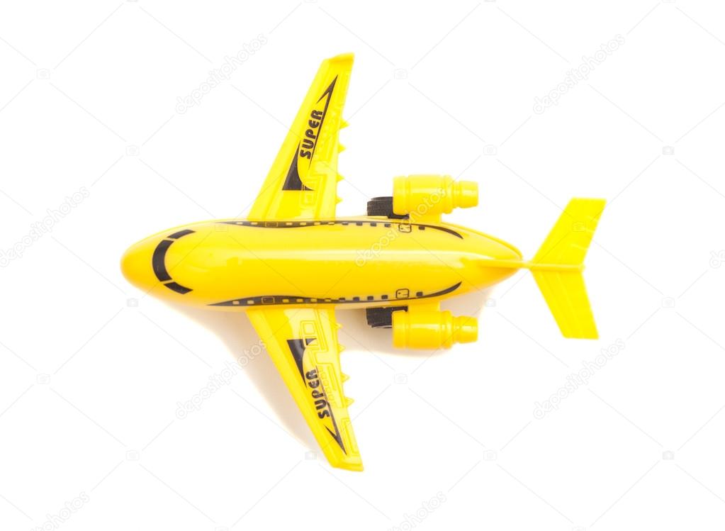 Plastic toy passenger jet plane on white background