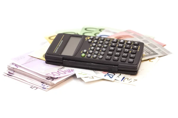 Calculator met eurobiljetten geïsoleerd op wit — Stockfoto