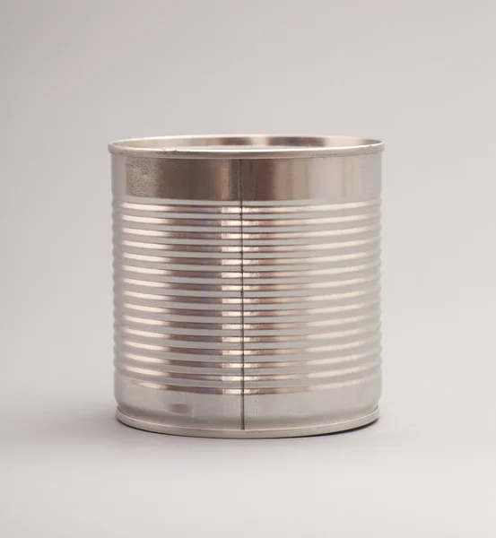 A silver tin can isolated on a gray background — Stock Photo, Image