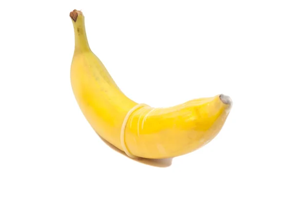 Banana with condom isolated on white — Stock Photo, Image