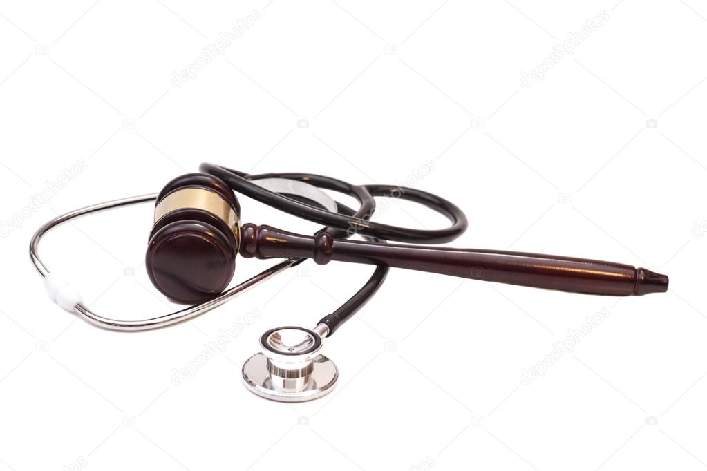 Stethoscope with judge gavel isolated on white