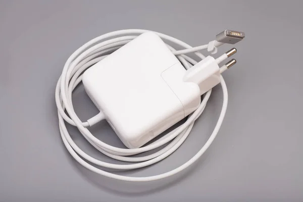 Electrical adapter to USB port on a gray background — Stock Photo, Image