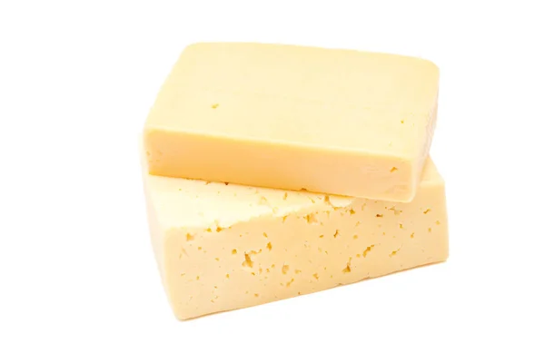 Rebanadas de queso sobre fondo blanco — Foto de Stock
