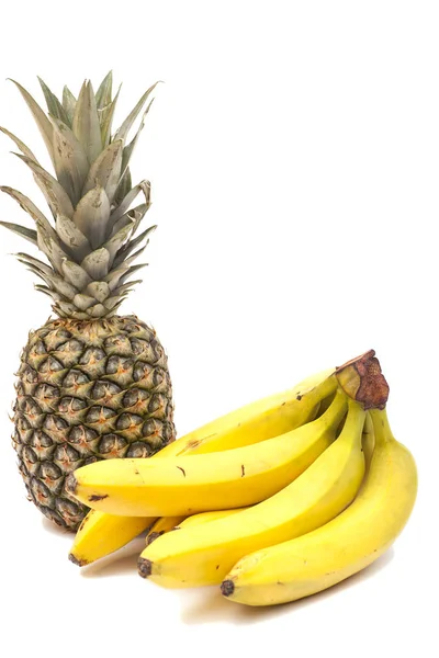 Kilka banany i ananasy — Zdjęcie stockowe