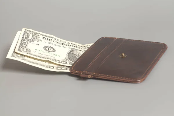 Brown Leather Wallet With One Dollars On Gray Background — Stock Photo, Image