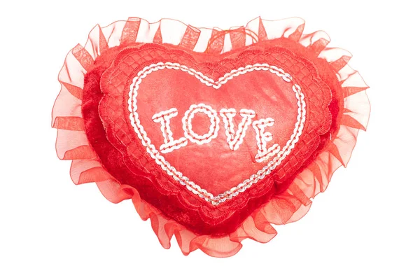 Червона подушка серце з написом: любов — стокове фото