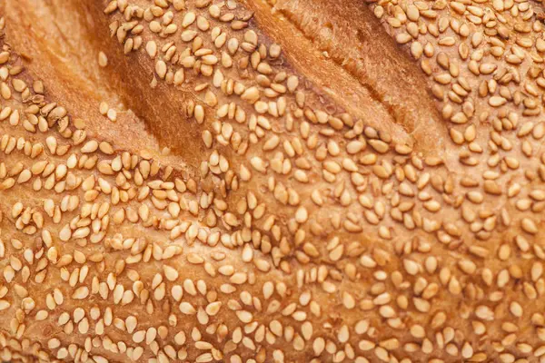 Hvitt brød med sesamstruktur – stockfoto