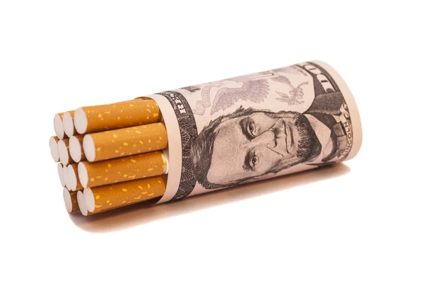 Сигарети і гроші на білому тлі — стокове фото