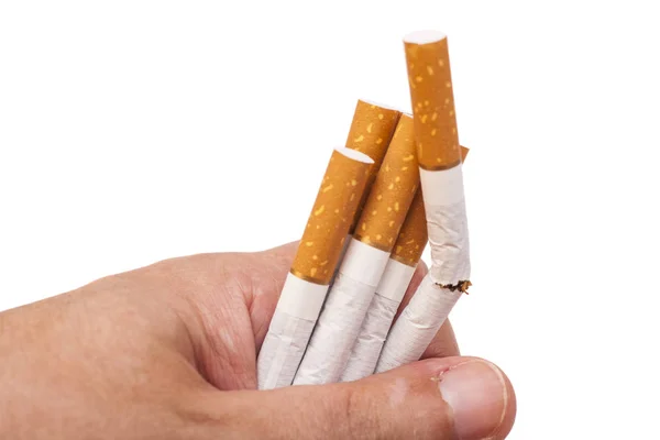 Dépendance. Gros plan des cigarettes cassées sur la main de l'homme. Arrête tes conneries. — Photo