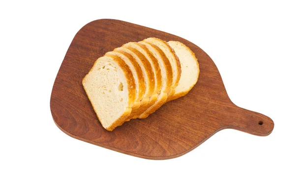 Fresh sliced loaf of bread on wooden chopping board — Stock Photo, Image