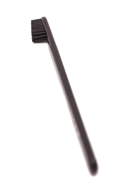 Μαύρη οδοντόβουρτσα απομονωμένη σε λευκό φόντο — Φωτογραφία Αρχείου