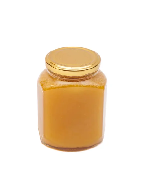 Honey in jar on white background — Stock Photo, Image