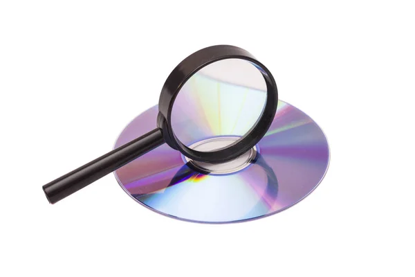 Magnifier glass and DVD — Stok fotoğraf