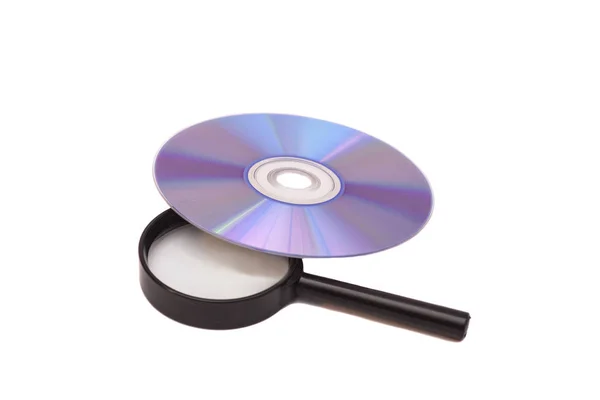 Lupa de vidro e DVD isolado — Fotografia de Stock