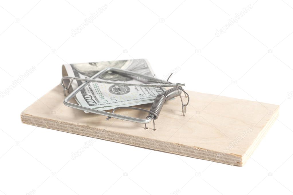 Hundred dollars in a mousetrap isolated on white background