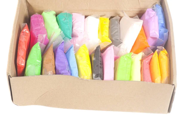 Argila polimérica colorida em caixa isolada em branco — Fotografia de Stock